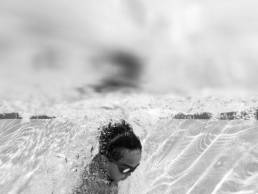 boy jumps in water