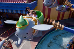 mom rides Dumbo with her kids