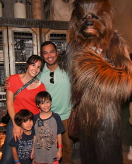 my family poses with Chewbacca inside the Rise of the Resistance queue