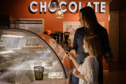 mother and daughter buy chocolates