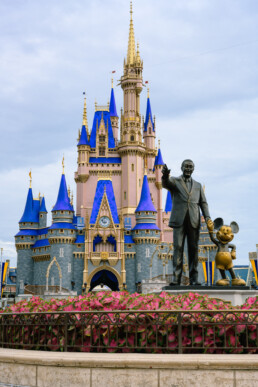 Walt and Mickey statue in front of the freshly painted castle